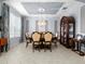 Elegant dining room with stylish decor, a chandelier, and ample space for formal gatherings at 887 Daisy Hill Ct, Apopka, FL 32712