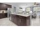 Kitchen island with granite countertops, stainless steel appliances, and lots of natural light at 887 Daisy Hill Ct, Apopka, FL 32712