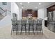 Kitchen island with granite countertops, stainless steel appliances, and modern bar seating at 887 Daisy Hill Ct, Apopka, FL 32712