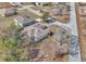 Aerial view of a home showing its layout, landscaping, and proximity to the neighborhood streets at 9150 Se 153Rd Pl, Summerfield, FL 34491