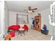 Bright bedroom with neutral tones, a ceiling fan, and ample space for relaxation at 9150 Se 153Rd Pl, Summerfield, FL 34491