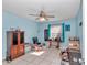 Bright bedroom with tile floors, a ceiling fan, natural light, and ample space for storage at 9150 Se 153Rd Pl, Summerfield, FL 34491