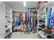 Walk-in closet with custom shelving, racks, and storage solutions for clothing and accessories at 9905 Skylark Ln, Groveland, FL 34736