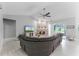 Cozy living room featuring a stone fireplace, vaulted ceiling, and a comfortable seating area at 9905 Skylark Ln, Groveland, FL 34736