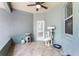 Enclosed porch featuring painted blue walls, tile floors, and cat trees at 9905 Skylark Ln, Groveland, FL 34736