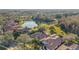 An aerial view of the community with beautiful pond and landscape at 9930 Santa Barbara Ct, Howey In The Hills, FL 34737