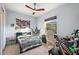 Fun bedroom with a modern ceiling fan and playful decor at 9930 Santa Barbara Ct, Howey In The Hills, FL 34737