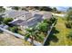 Aerial view of the property featuring an enclosed pool area, mature trees, and a white fence at 100 Grand Reserve Dr, Davenport, FL 33837