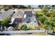 Overhead view of a home showcasing solar panels, a screened pool, and backyard landscaping at 100 Grand Reserve Dr, Davenport, FL 33837