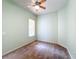 A cozy bedroom is well lit with a ceiling fan and neutral carpet at 100 Grand Reserve Dr, Davenport, FL 33837