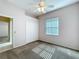 This spacious bedroom features a ceiling fan, a closet, and a window for natural light at 100 Grand Reserve Dr, Davenport, FL 33837