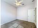 Bedroom with carpeted floor, ceiling fan and natural light, offering serene space at 100 Grand Reserve Dr, Davenport, FL 33837