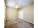 A bedroom with neutral colored walls, a ceiling fan, and a closet at 100 Grand Reserve Dr, Davenport, FL 33837