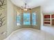 Bright breakfast nook with large windows overlooking the pool, creating a serene dining space at 100 Grand Reserve Dr, Davenport, FL 33837