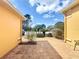 The exterior of this house features a paver driveway and manicured landscaping at 100 Grand Reserve Dr, Davenport, FL 33837