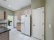 Bright and spacious kitchen featuring light wood cabinets, granite countertops and tile floor at 100 Grand Reserve Dr, Davenport, FL 33837