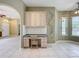 Cozy kitchen nook featuring built-in desk, cabinets, and a chair, providing a functional workspace at 100 Grand Reserve Dr, Davenport, FL 33837