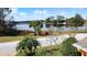 Scenic view of the lake with mature trees and landscaping at 100 Grand Reserve Dr, Davenport, FL 33837