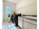 A laundry room with new appliances at 100 Grand Reserve Dr, Davenport, FL 33837