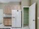 Well-organized walk-in pantry with white wire shelving, providing efficient storage solutions in the kitchen at 100 Grand Reserve Dr, Davenport, FL 33837