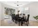 This elegant dining room has a large window with sliders that provide plenty of natural light at 1044 Alcove Loop, The Villages, FL 32162