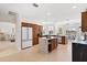 Spacious kitchen featuring custom cabinets, large island, and modern stainless steel appliances at 1044 Alcove Loop, The Villages, FL 32162