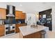 Kitchen featuring a marble island, stainless steel appliances, and an open design at 1044 Alcove Loop, The Villages, FL 32162