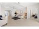 Bright and open living room with tile floors, neutral colors, and a welcoming atmosphere at 1044 Alcove Loop, The Villages, FL 32162