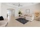 Cozy living room featuring tile floors, neutral colors, and comfortable seating at 1044 Alcove Loop, The Villages, FL 32162