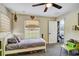 Bedroom featuring natural light from the large window and convenient built-in shelving at 10909 Mattioda Rd, Groveland, FL 34736