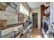 Well-organized laundry room with washer, dryer, shelves, and plenty of storage baskets at 10909 Mattioda Rd, Groveland, FL 34736