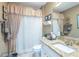 Granite countertops and white cabinetry are the focal points of this bathroom at 1137 Alfredo Ave, The Villages, FL 32159