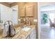 Bathroom featuring granite countertop with views into the adjacent living area at 1137 Alfredo Ave, The Villages, FL 32159