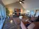 Cozy living room featuring comfortable seating, stylish decor, and lots of natural light from sliding glass doors at 1152 Villa Ln # 104, Apopka, FL 32712