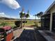 Outdoor patio featuring a table and grill, offering a picturesque spot for dining and entertainment with serene views at 1152 Villa Ln # 104, Apopka, FL 32712