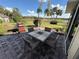 Outdoor patio featuring a table with four chairs and a grill with scenic views, perfect for outdoor dining at 1152 Villa Ln # 104, Apopka, FL 32712