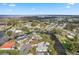 Scenic overhead view of the property in a waterfront canal community with lake access at 11820 Watts Ct, Tavares, FL 32778