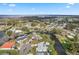 An aerial view of canal front homes, highlighting boating access and nearby Lake Griffin at 11820 Watts Ct, Tavares, FL 32778