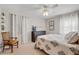 Well-lit bedroom with decorative accents, stylish furniture, and natural light at 11820 Watts Ct, Tavares, FL 32778