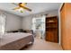 Bedroom featuring a built-in desk near the window and a wood bookshelf at 11820 Watts Ct, Tavares, FL 32778