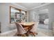 Bright dining room with white tile flooring, gray walls and traditional decor at 11820 Watts Ct, Tavares, FL 32778