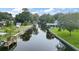 Scenic waterfront view showcasing a canal with docks and lush greenery along the banks at 11820 Watts Ct, Tavares, FL 32778