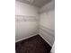 Walk-in closet with wire shelving and carpet flooring at 11943 Iselle Dr, Orlando, FL 32827