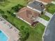 Well-manicured lawn surrounds this appealing single-story home near a neighborhood pool at 12335 Se 176Th Loop, Summerfield, FL 34491