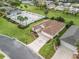 Lovely single-story home with an attached three-car garage and community pool at 12335 Se 176Th Loop, Summerfield, FL 34491