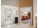 Bright foyer with tile floors and decorative rug flows into the living spaces at 12335 Se 176Th Loop, Summerfield, FL 34491