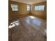 Bedroom featuring tile floor and natural light from two windows at 13 Spring Loop, Ocala, FL 34472