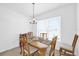 Bright dining area with a large window offering abundant natural light and a cozy atmosphere at 1392 Kenneth St, The Villages, FL 34762