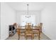 Well-lit dining room with a classic wooden dining set and a large window for natural light at 1392 Kenneth St, The Villages, FL 34762