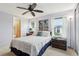 Bright bedroom featuring an ensuite bathroom and dual windows, creating a serene atmosphere at 1430 Mohawk Cir, Tavares, FL 32778